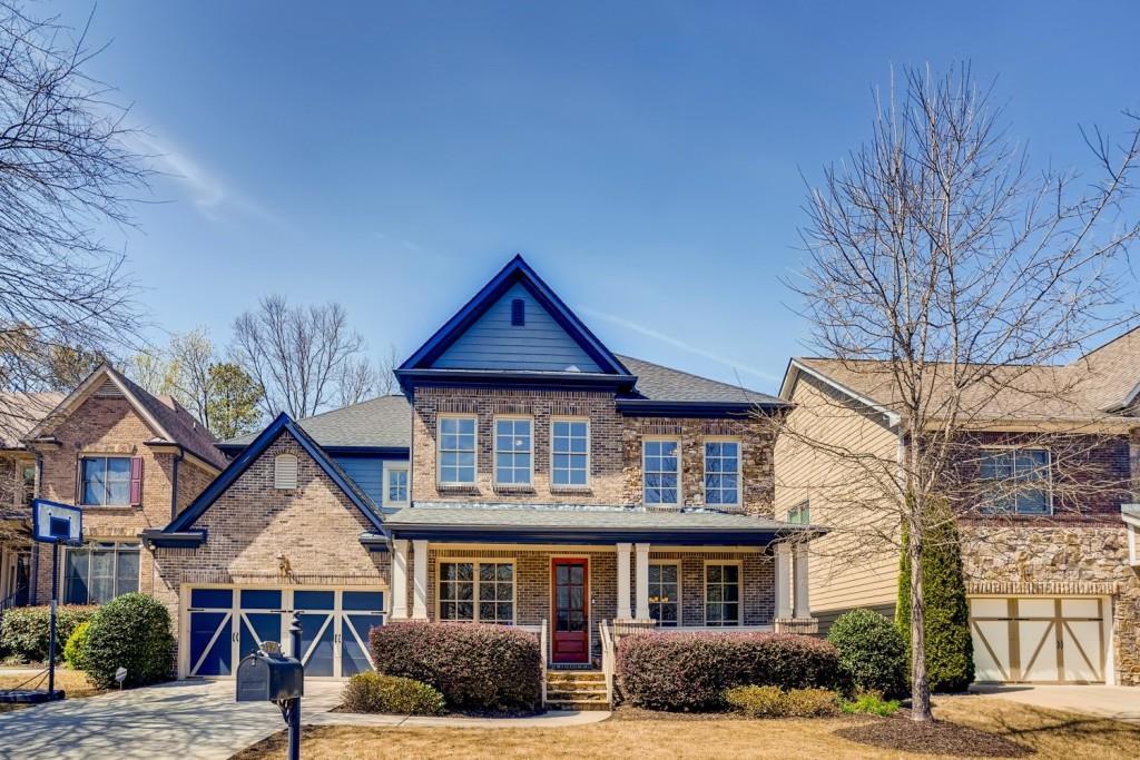 view of front of home featuring covered porch and a garage