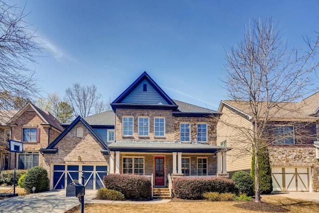 view of front of home featuring covered porch and a garage