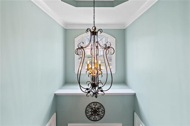 details with crown molding and a notable chandelier