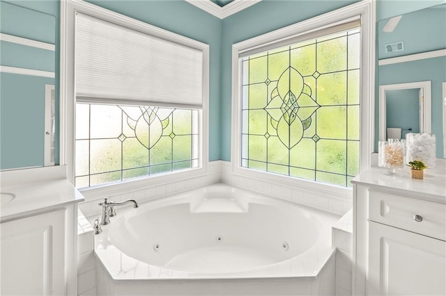 bathroom featuring crown molding, a healthy amount of sunlight, and a relaxing tiled bath