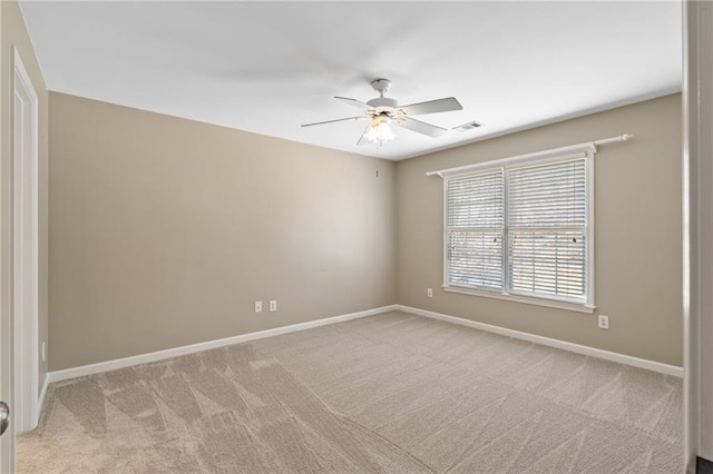 carpeted empty room with ceiling fan