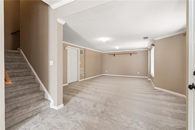 carpeted spare room with ornamental molding