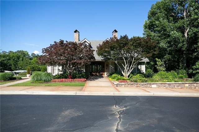 view of property hidden behind natural elements