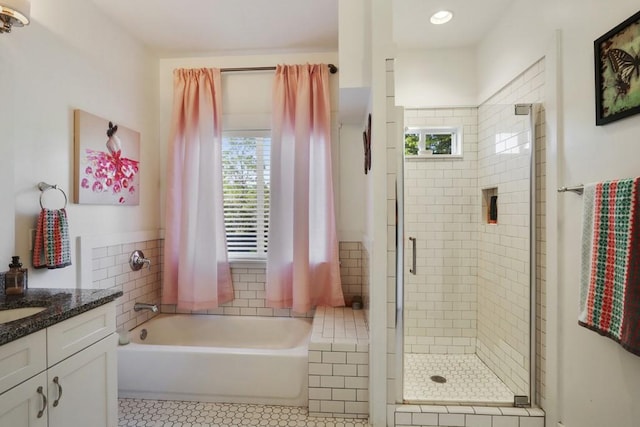 bathroom featuring vanity, tile floors, and separate shower and tub