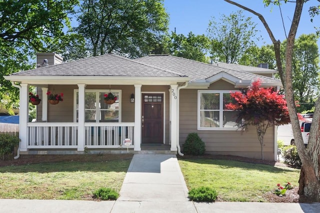 view of front of home with a front lawn and a porch