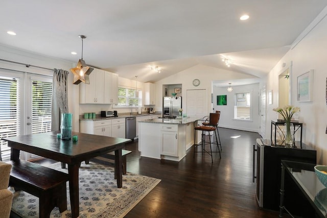 interior space featuring lofted ceiling and dark hardwood / wood-style floors