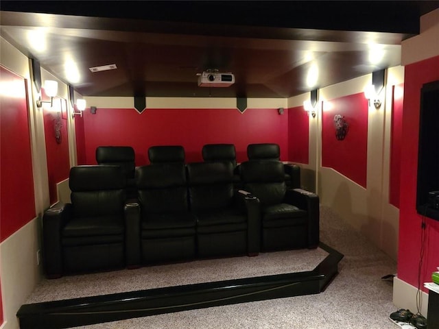 home theater featuring lofted ceiling and carpet