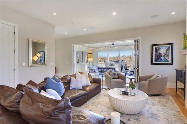 1068 Amsterdam Avenue Ne, Atlanta, GA 30306 - living room featuring ceiling fan and light wood-type flooring