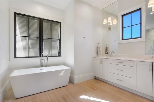 1068 Amsterdam Avenue Ne, Atlanta, GA 30306 - bathroom with double vanity, a bathing tub, and hardwood / wood-style floors