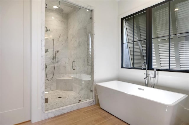 1068 Amsterdam Avenue Ne, Atlanta, GA 30306 - bathroom featuring independent shower and bath and wood-type flooring