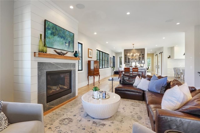 1068 Amsterdam Avenue Ne, Atlanta, GA 30306 - living room with a chandelier and light wood-type flooring