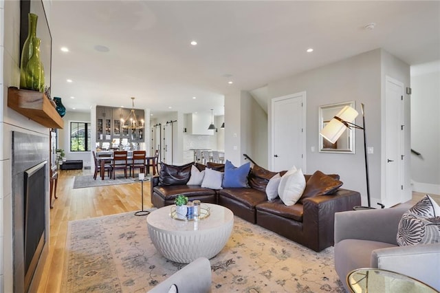 1068 Amsterdam Avenue Ne, Atlanta, GA 30306 - living room with a notable chandelier and light hardwood / wood-style flooring