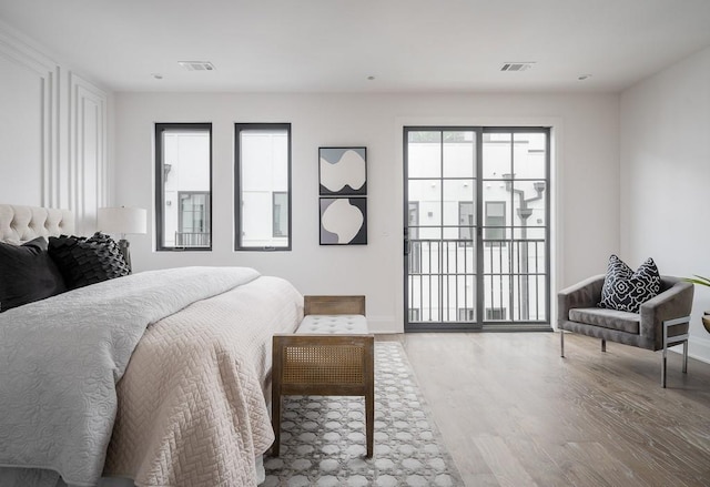 bedroom with light hardwood / wood-style flooring