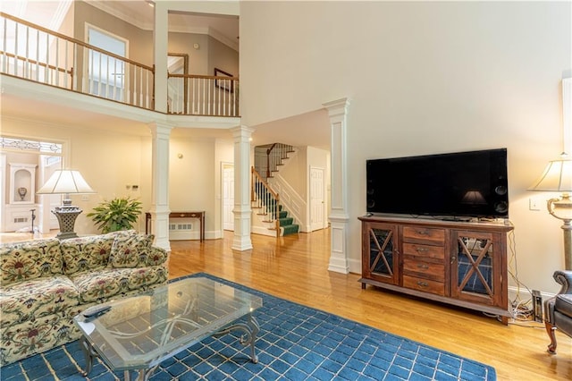 54 Old Fuller Mill Road Ne, Marietta, GA 30067 - living room with crown molding, light wood-type flooring, a high ceiling, and decorative columns