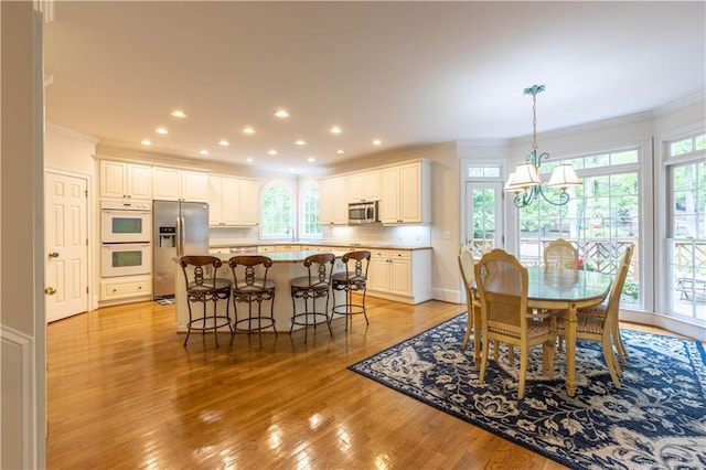 54 Old Fuller Mill Road Ne, Marietta, GA 30067 - dining room featuring a chandelier, ornamental molding, and light hardwood / wood-style floors