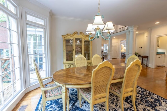 54 Old Fuller Mill Road Ne, Marietta, GA 30067 - dining space with ornate columns, plenty of natural light, ornamental molding, and light hardwood / wood-style flooring