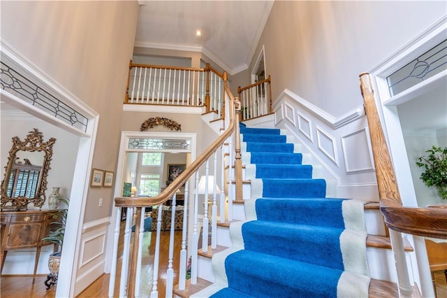 54 Old Fuller Mill Road Ne, Marietta, GA 30067 - stairs with light hardwood / wood-style floors, ornamental molding, and a towering ceiling