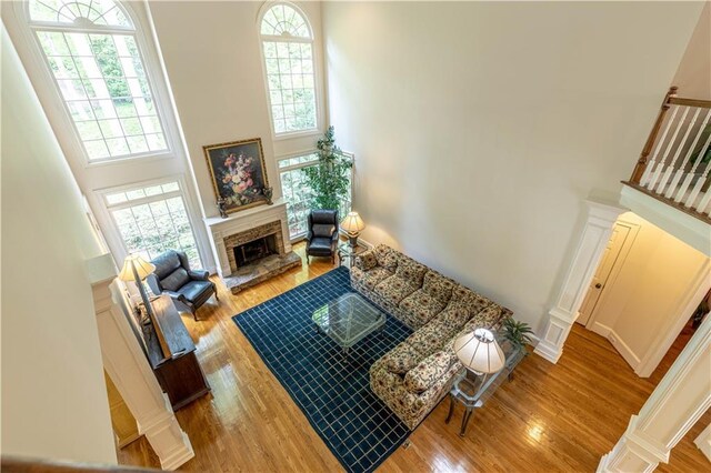 54 Old Fuller Mill Road Ne, Marietta, GA 30067 - living room featuring light hardwood / wood-style floors, a high ceiling, and ornate columns
