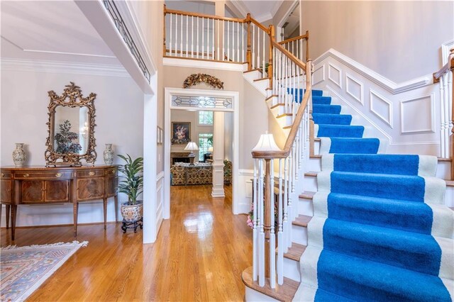 54 Old Fuller Mill Road Ne, Marietta, GA 30067 - foyer entrance with crown molding, light hardwood / wood-style flooring, and a towering ceiling