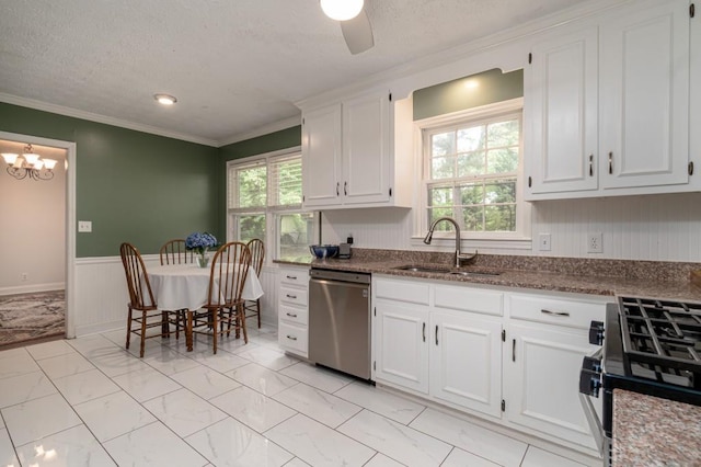 kitchen with white cabinets, stainless steel dishwasher, and ceiling fan with notable chandelier