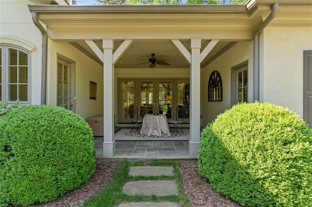 doorway to property with ceiling fan and a patio