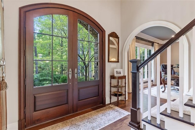 foyer featuring french doors and dark wood-type flooring