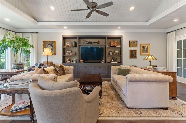 living room featuring ceiling fan, ornamental molding, and light hardwood / wood-style floors