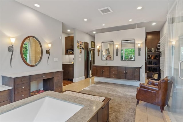 bathroom with tile floors and oversized vanity