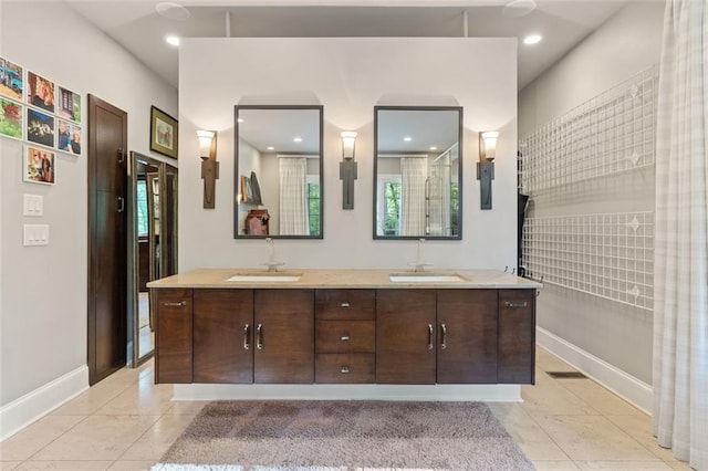 bathroom featuring dual vanity and tile flooring