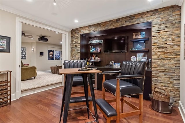 interior space featuring ceiling fan and hardwood / wood-style flooring