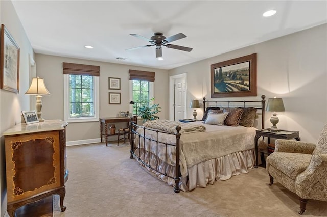 bedroom featuring ceiling fan and light colored carpet