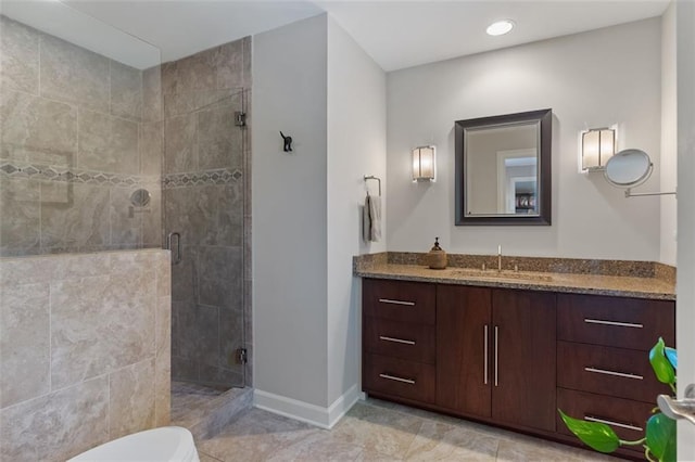 bathroom with tile flooring, vanity, toilet, and an enclosed shower