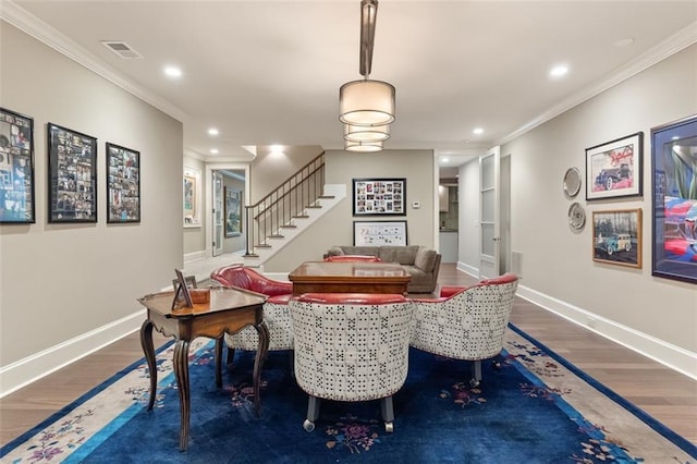 dining area with dark hardwood / wood-style flooring and ornamental molding