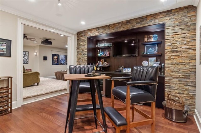 interior space with hardwood / wood-style floors and ceiling fan