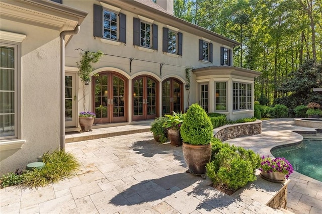 exterior space with french doors and a patio area