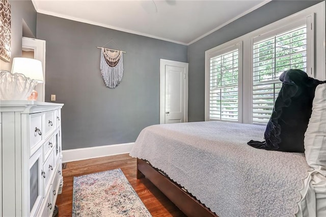 3248 W Shadowlawn Avenue Ne, Atlanta, GA 30305 - bedroom featuring crown molding and dark wood-type flooring