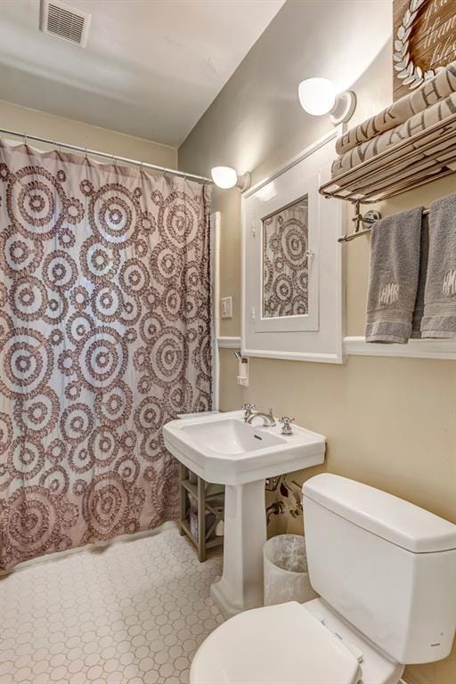 3248 W Shadowlawn Avenue Ne, Atlanta, GA 30305 - bathroom with tile flooring and toilet