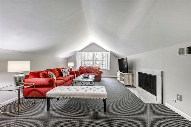 3248 W Shadowlawn Avenue Ne, Atlanta, GA 30305 - living room featuring dark colored carpet and vaulted ceiling