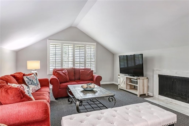 3248 W Shadowlawn Avenue Ne, Atlanta, GA 30305 - living room with a high end fireplace, dark carpet, and lofted ceiling