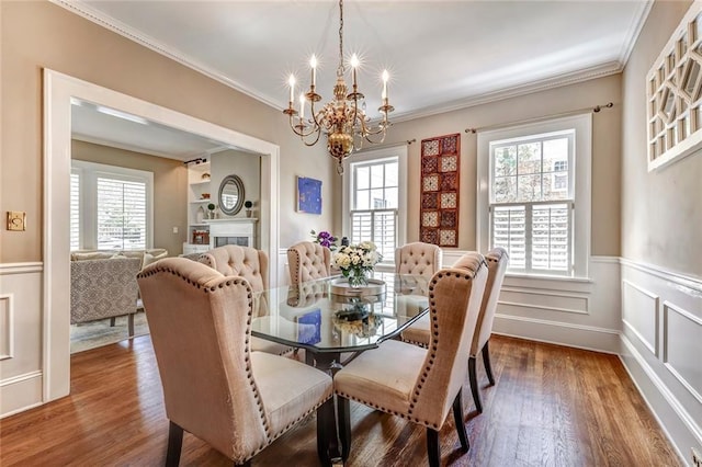 3248 W Shadowlawn Avenue Ne, Atlanta, GA 30305 - dining space featuring a notable chandelier, dark wood-type flooring, and ornamental molding