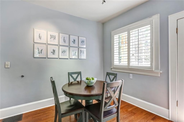 3248 W Shadowlawn Avenue Ne, Atlanta, GA 30305 - dining area with hardwood / wood-style flooring