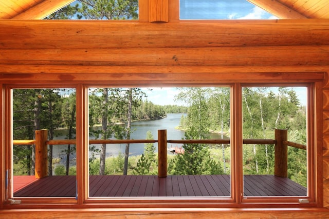 entryway featuring lofted ceiling, a water view, and wood ceiling