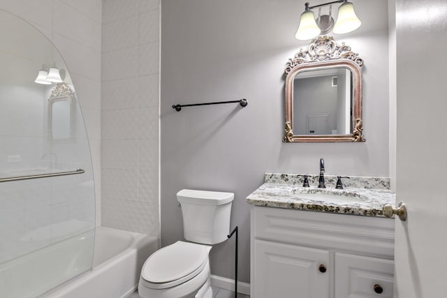 full bathroom featuring tiled shower / bath combo, vanity, and toilet