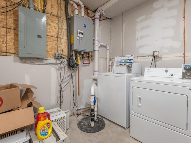 laundry area featuring washing machine and clothes dryer and water heater