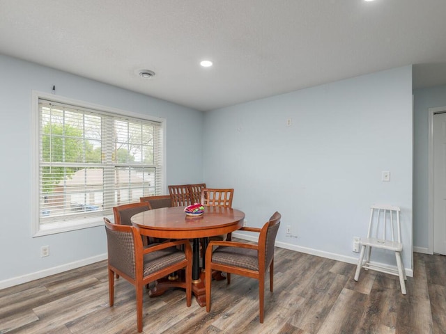 dining area with dark hardwood / wood-style floors