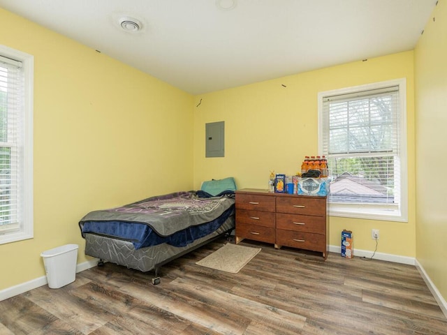bedroom with dark wood-type flooring
