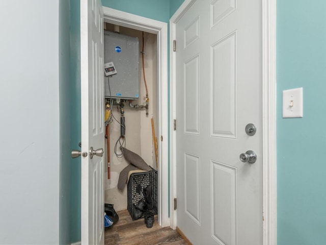 interior space featuring dark hardwood / wood-style flooring and tankless water heater