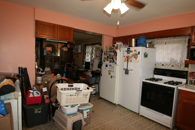 kitchen featuring white appliances, ceiling fan, and light tile floors