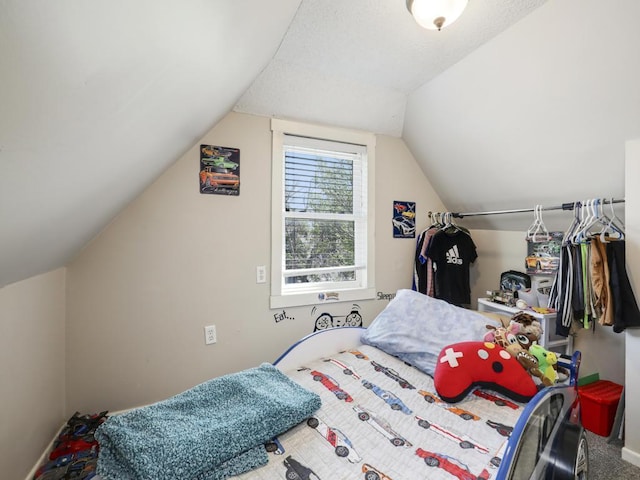 bedroom featuring carpet flooring and vaulted ceiling