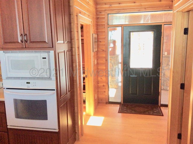 entryway with hardwood / wood-style flooring